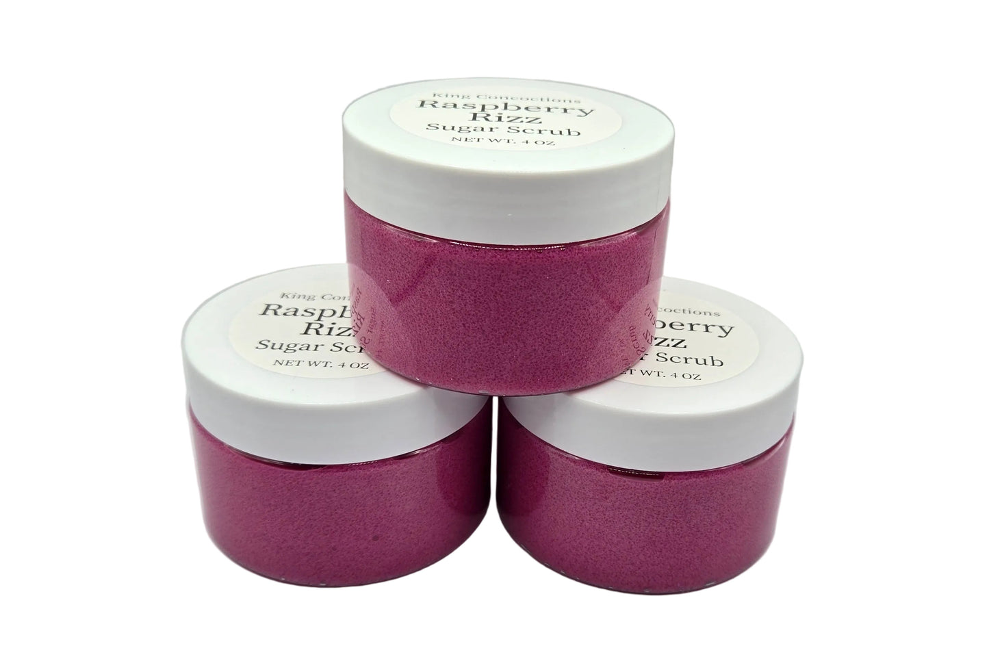 Three jars of raspberry sugar scrub.